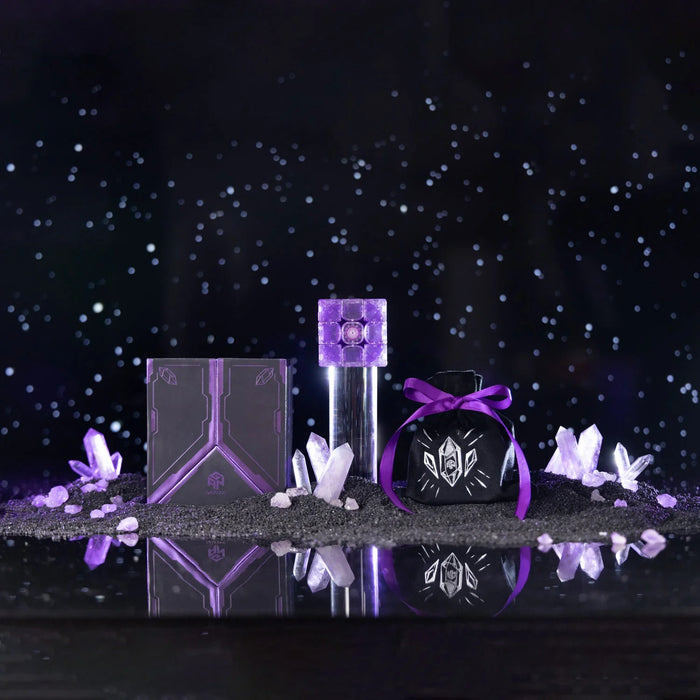 Purple Gan16 Maglev cube puzzle with crystals, black box, and velvet pouch on black surface
