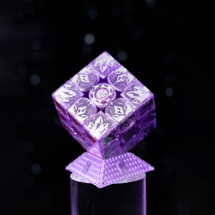 Purple transparent GAN 16 Maglev Max Rubik's Cube with crystal designs on a lit pedestal