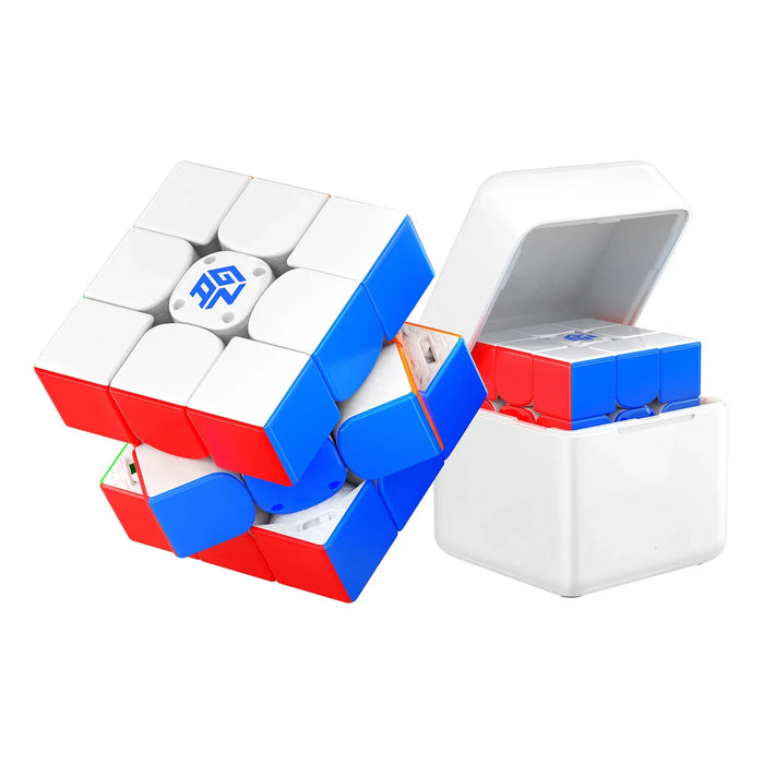 Gancube 3x3 speed cube puzzle partially rotated next to white storage case on white background