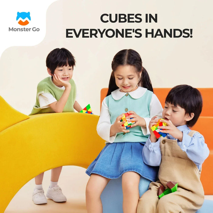 Three children playing with colorful magnetic cubes on modern yellow and orange furniture