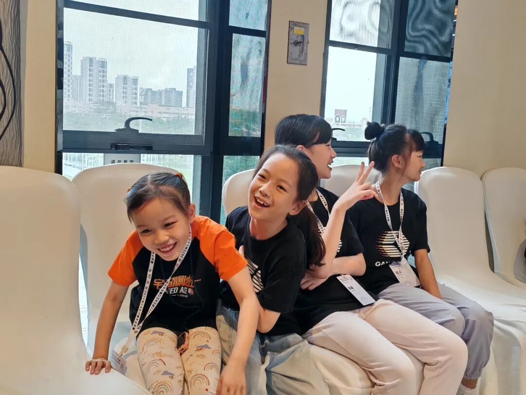 Young GANCUBE Team members resting and having fun during a speedcubing training session