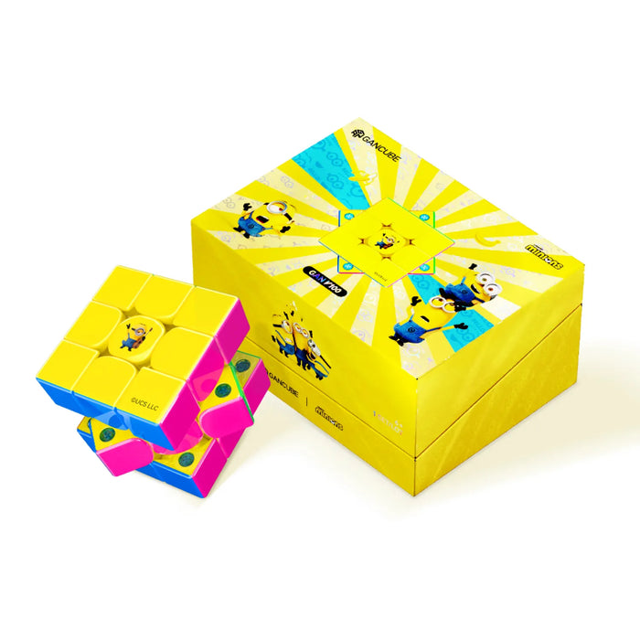 Minions-themed speed cube with yellow, pink, and blue colors next to branded packaging