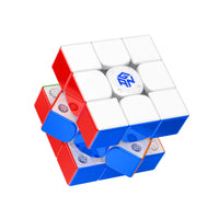 GAN speed cube with red, white, and blue colors, showing internal mechanism and logo on center piece