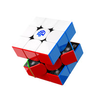 GAN speed cube with red, white, blue stickers and visible internal mechanism on white background