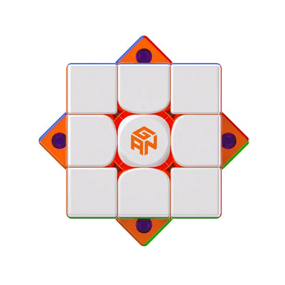 GAN speed cube with white face and orange logo, featuring colorful transparent edges and purple magnets