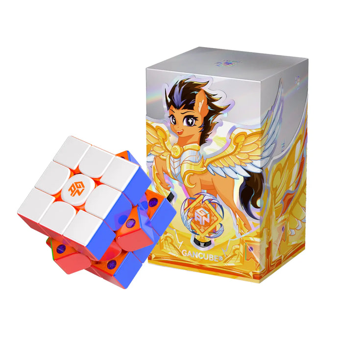 GAN speed cube with vibrant colors beside its illustrated box featuring a winged character