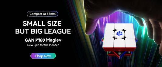 Hand reaching for compact 55mm speed cube with visible internal magnets, colorful background