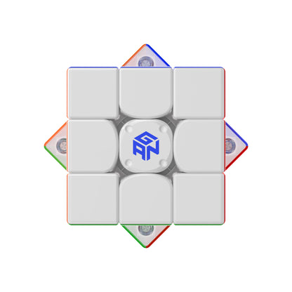 GAN speed cube with white face and blue logo, featuring colorful edge pieces and magnetic mechanism