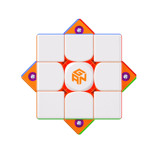 GANCUBE speed cube with white faces, orange edges, and central GAN logo on a white background