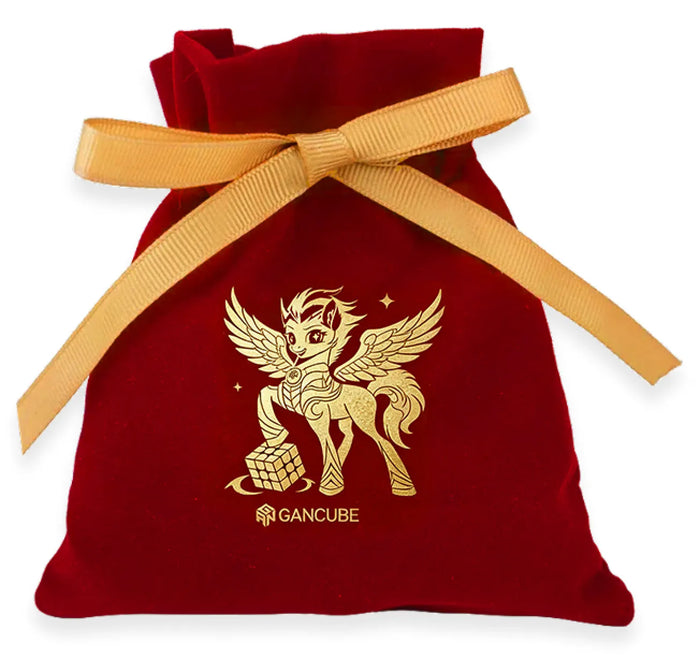 Red velvet pouch with gold winged pony and GANCUBE logo, tied with ribbon